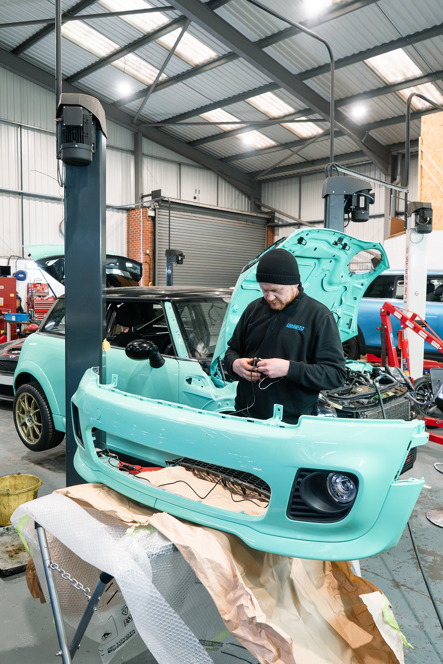 front bumper of a MINI Cooper R56 having grill and lights installed