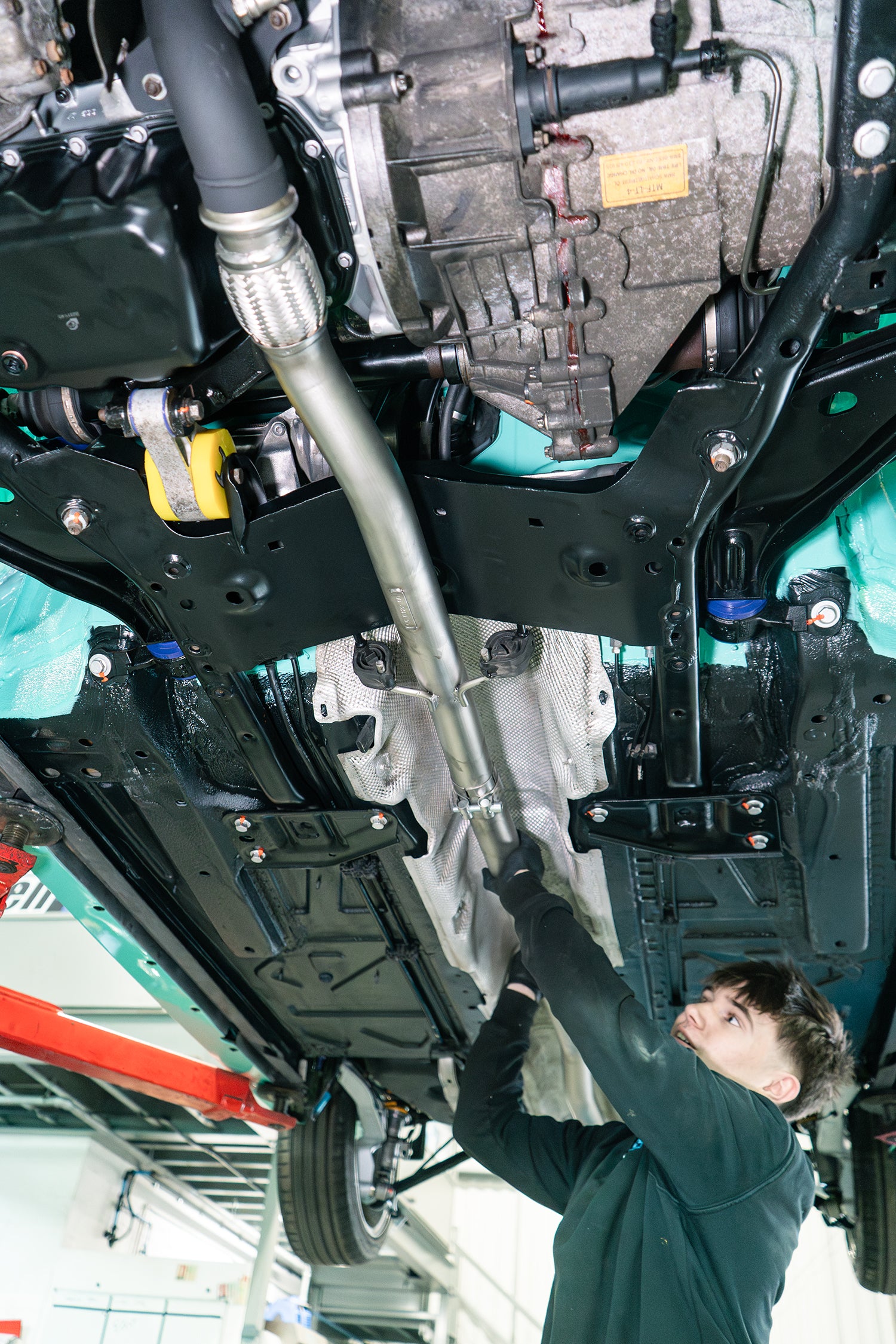 Ragazzon exhaust being installed to a MINI R56 with Powerflex engine and subframe bushes