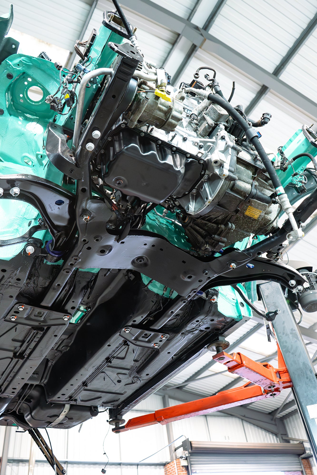 rust protected chassis underside with the subframe and engine back in the MINI R56.