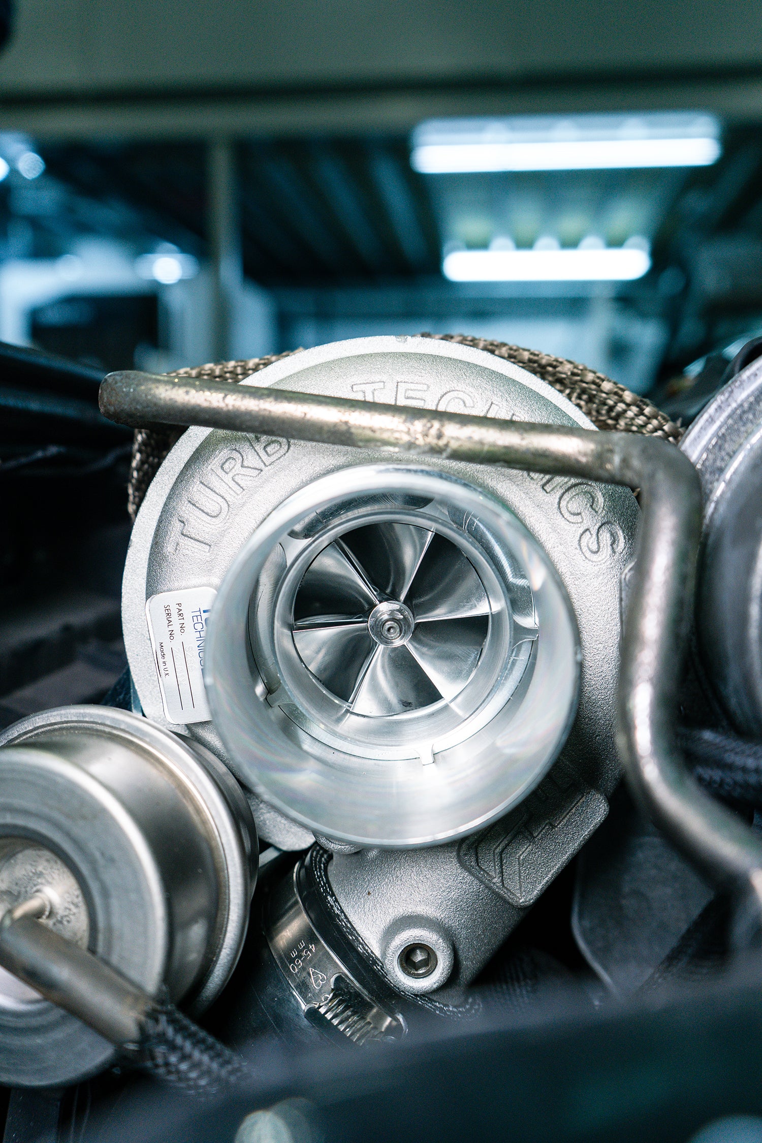 close up of a turbo technics MINI R56 turbo in the engine bay.